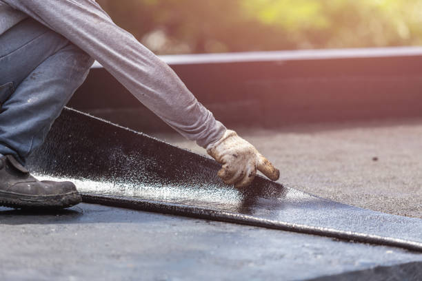 Professional Basement Waterproofing technician working in Winchester, VA